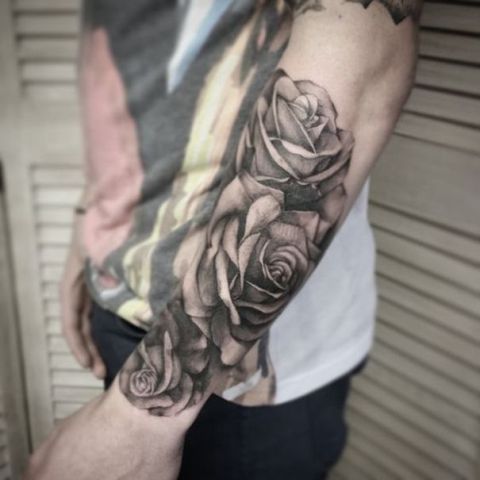 Three roses tattoo on the arm