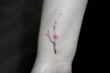 cute cherry blossom wrist tattoo