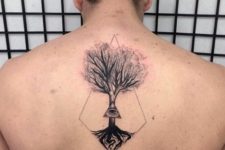 Tree and eye tattoo on the back