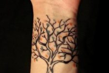 Tree with colorful leaves tattoo on the wrist