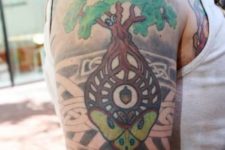 Tree with green crown tattoo