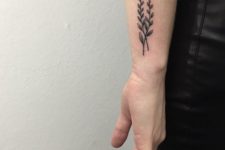 Two branches with leaves tattoo
