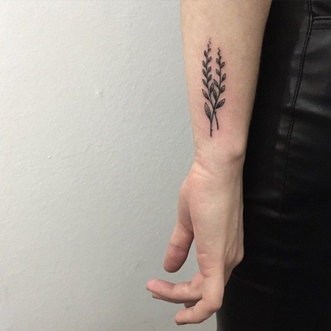 Two branches with leaves tattoo