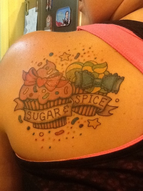 Two cupcakes tattoo on the shoulder
