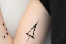 minimalist tree tattoo on an arm