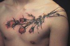 Watercolor rose tattoo on the chest and shoulder