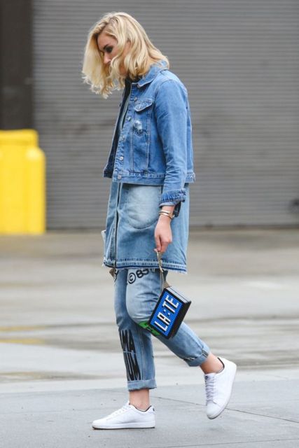 With cuffed jeans, denim long shirt, unique bag and white sneakers