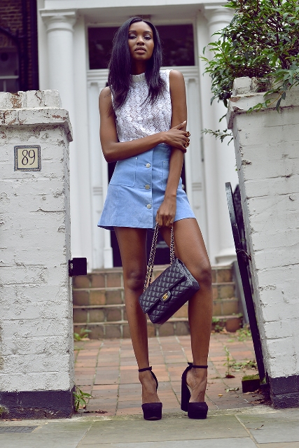 With lace top, black shoes and chain strap bag