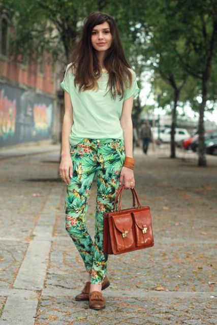 With light green t-shirt, brown flat shoes and brown leather bag