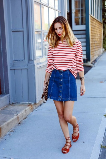 With striped loose shirt, red flats and leopard clutch
