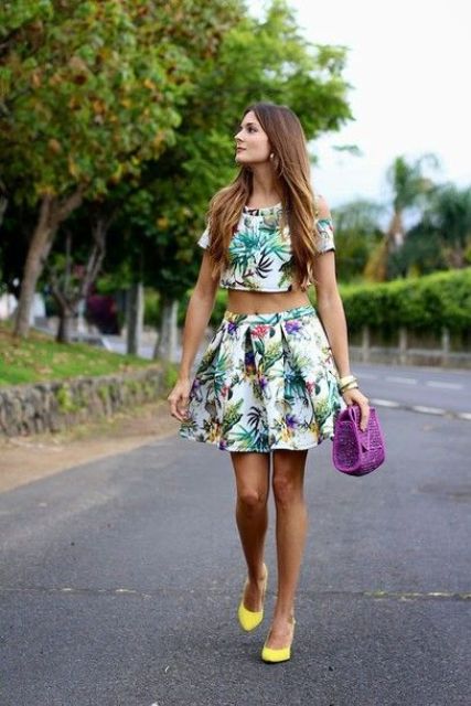 With tropical top, purple bag and yellow pumps