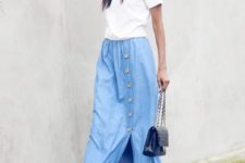 With white shirt, navy blue sandals and bag