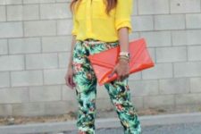 With yellow shirt, big clutch and beige pumps