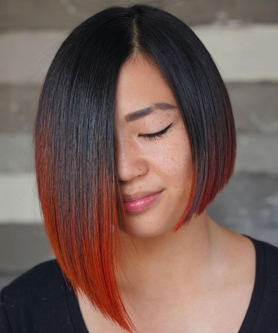 a bold asymmetrical black bob with red ends is a fantastic idea if you wanna make a statement with color and lines