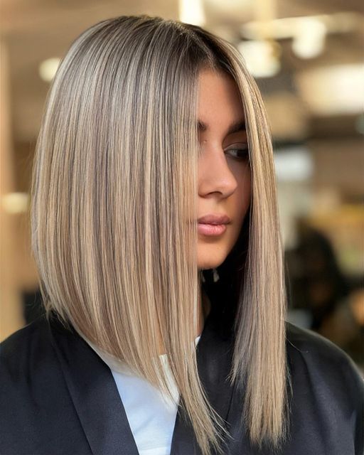 a chic long angled blonde bob with central parting is a cool and chic solution for everyone who wants long hair