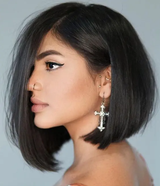a fantastic black asymmetrical bob with curled ends and a lot of volume is amazing