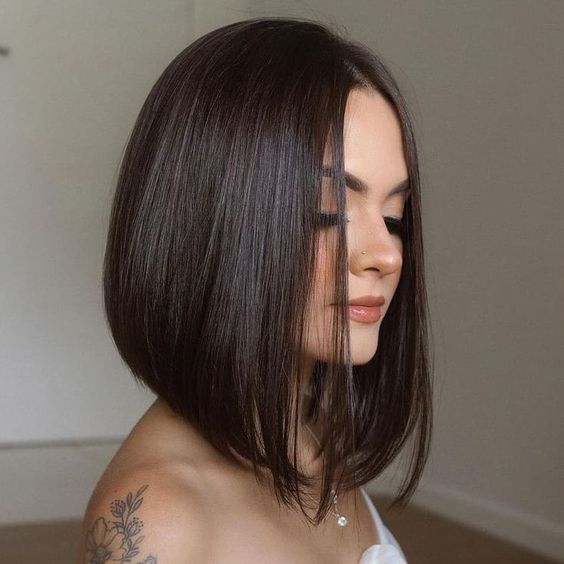 A lovely dark brunette A line bob with curled ends is a cool and chic idea to look eye catchy and bold