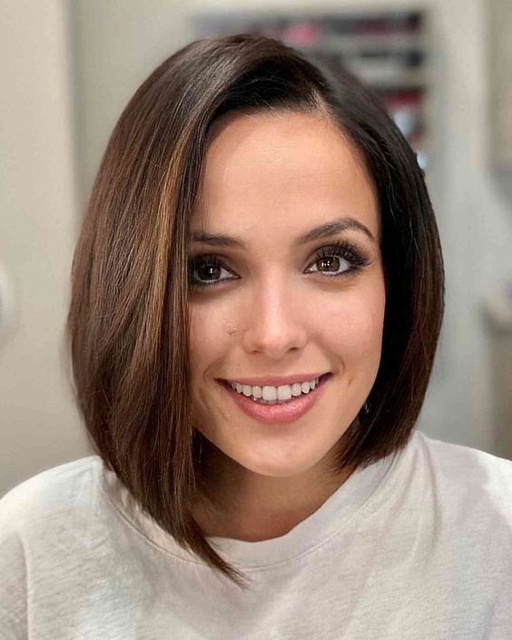 a lovely midi asymmetrical brunette bob with side parting and a lot of volume is a beautiful and cool solution