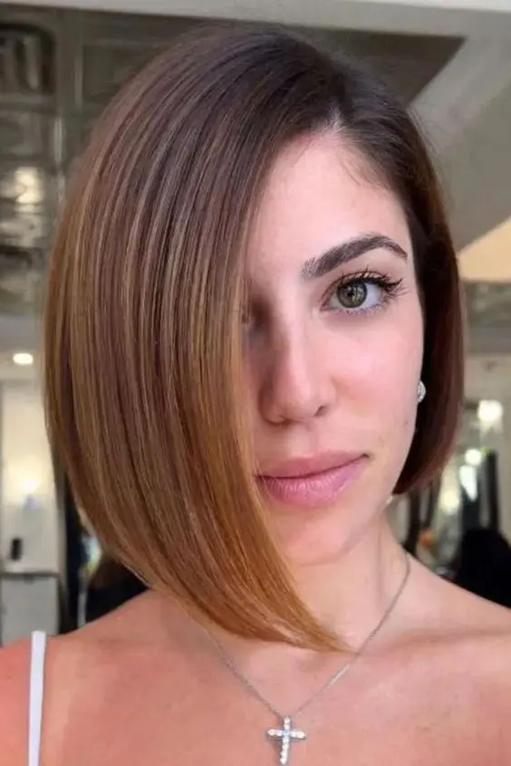 a pretty short asymmetrical bob with side parting is a stylish idea if you love short hair and asymmetry