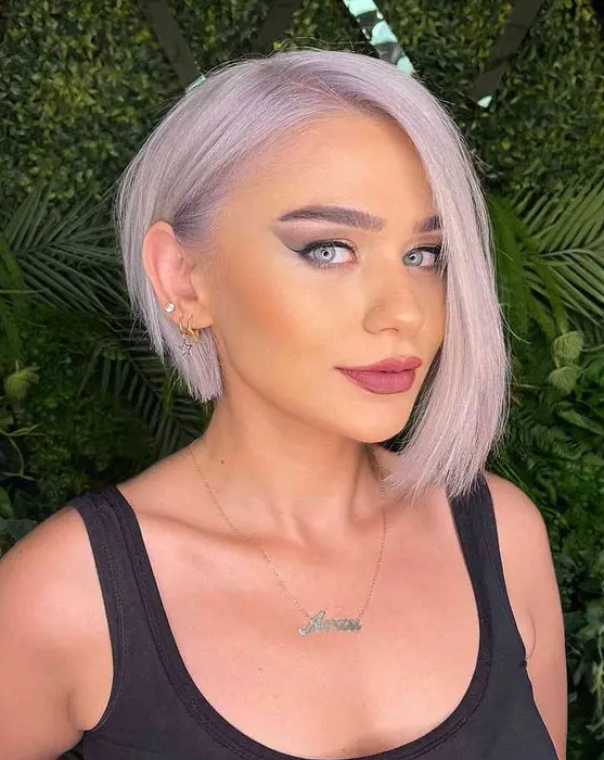 an asymmetrical lilac bob with side parting is amazing and chic idea that accent your face a lot