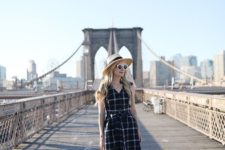 02 a black and white plaid sleeveless short dress, a hat, a straw bag and silver shoes