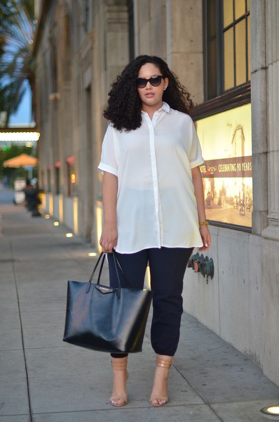navy pants, a white semi sheer long shirt, nude shoes and a black bag for a more casual look