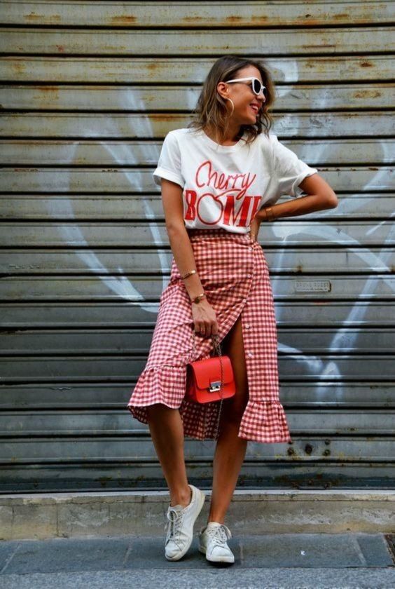 a white printed t-shirt, a red wrap gingahm skirt,white sneakers and a red bag