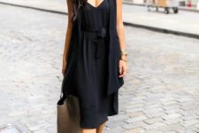 11 a black look with a slip dress and a duster is enlivened with blush strappy heels and a large bag