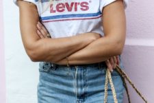 11 a blue denim mini skirt, a Levi’s t-shirt with a logo and a bag