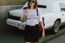 14 whimsy heart sneakers, a black skirt, a Gucci t-shirt and cool sunglasses for a badass look