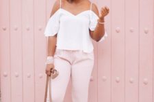 16 pink pants, a white cold shoulder top, a neutral bag and blush sandals