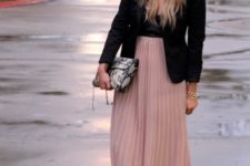 With black top, black blazer, printed clutch and sandals