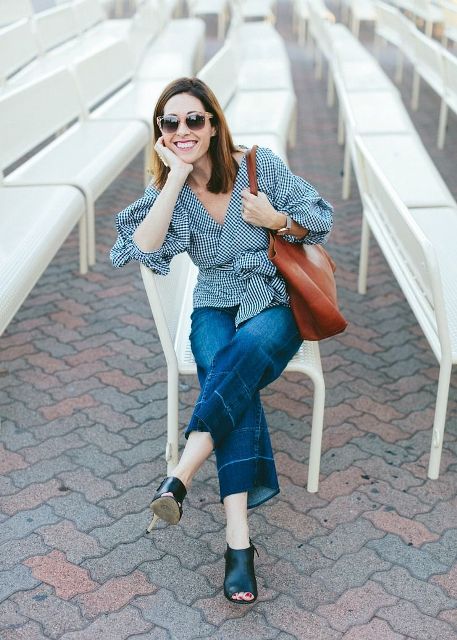 With crop jeans, brown tote and black mules
