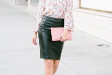 With leather skirt, pale pink clutch and heels