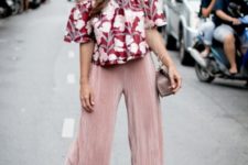 With pale pink culottes, small bag and lace up flats