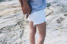With printed blouse, white shorts and brown backpack