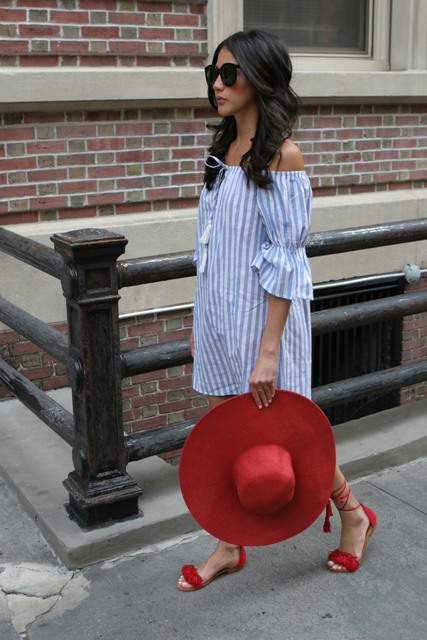 With red wide brim hat and lace up shoes