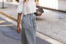 With striped culottes, printed clutch and pale pink mules