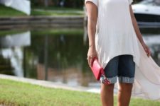 With white long shirt, red clutch and red and blue sandals