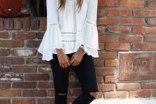 With white loose blouse and black distressed pants