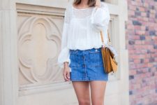 With white loose blouse, denim skirt and yellow bag