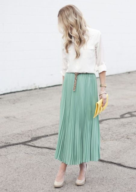 With white shirt, leopard belt, yellow clutch and beige shoes