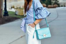 With white skirt, light blue bag and white shoes