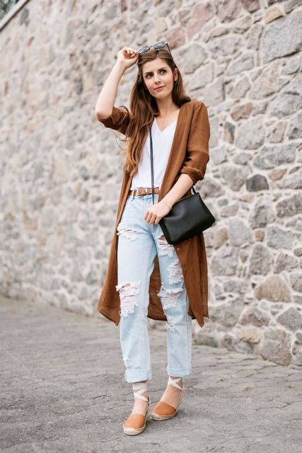 With white top, distressed jeans, brown long blazer and black bag