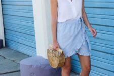 With white top, straw bag and wrap skirt