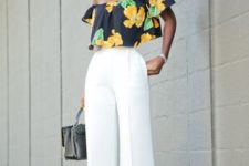 With white wide leg trousers and small bag