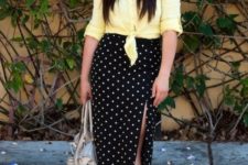 With yellow shirt, hat, gray bag and lace up flat sandals