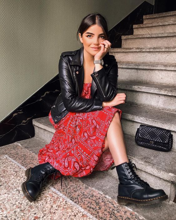 a bold red printed dress, a black leather jacket and black combat boots for a cool look