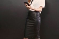 05 a white shirt with a black bow, a black leather skirt, black heels for a stylish look