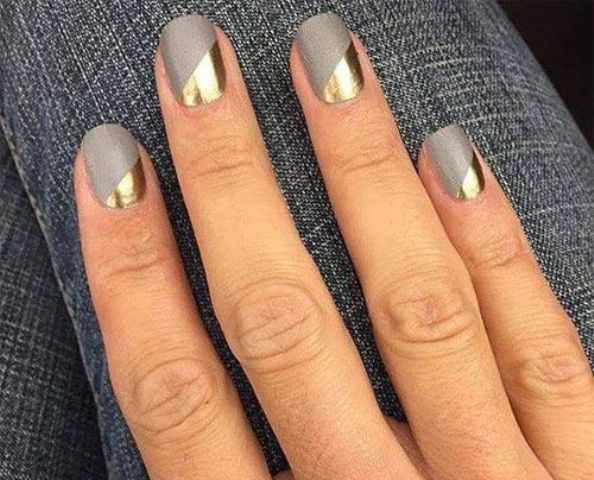 a matte grey manicure with gold geometric touches for a statement